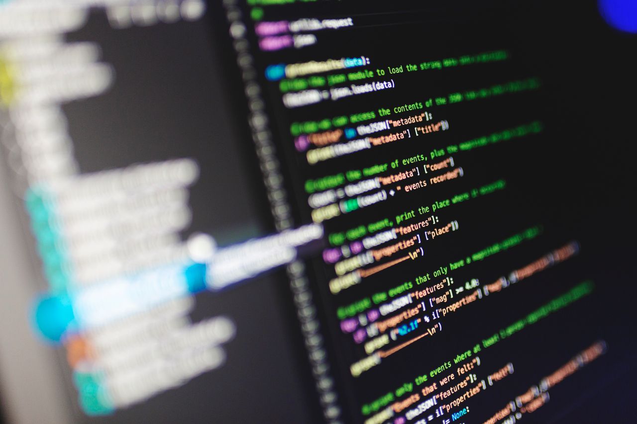Services Close-up of a computer screen displaying colorful programming code in JavaScript.