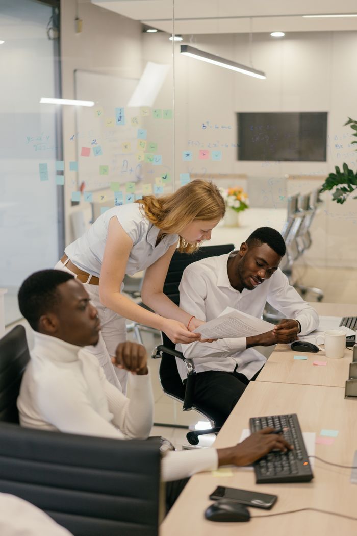 Home Multicultural team engaged in collaborative work session in a modern office environment.